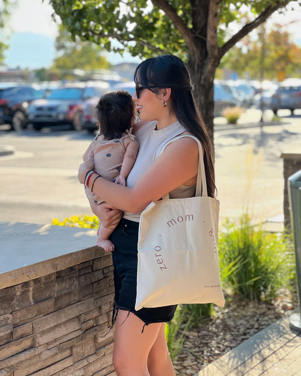 Hispanic Mom and baby with tote back by Tuck and Bundle